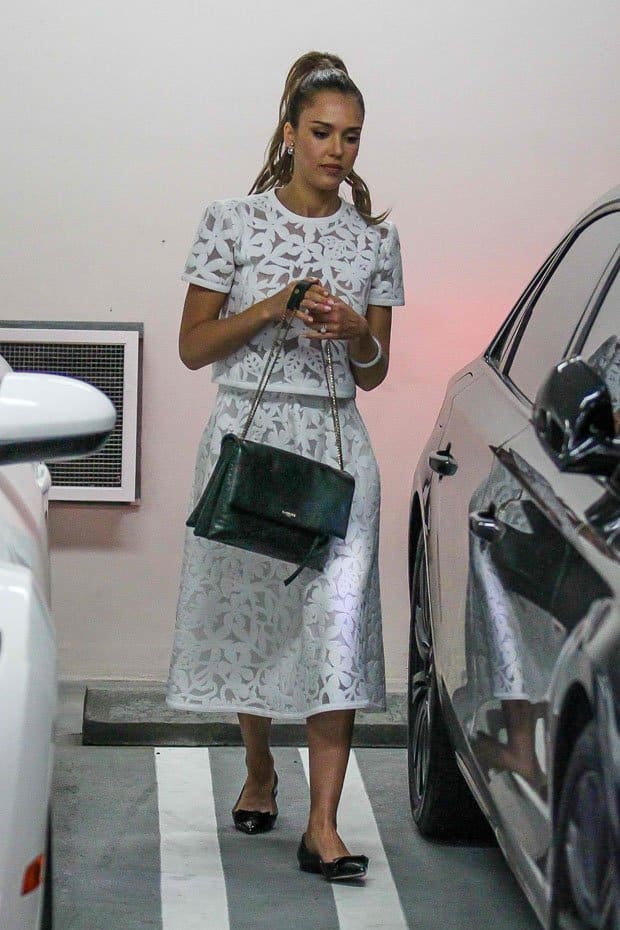 Jessica Alba styled a Tanya Taylor top and skirt with Sarah Flint flats and a bottle green Lanvin Sugar bag
