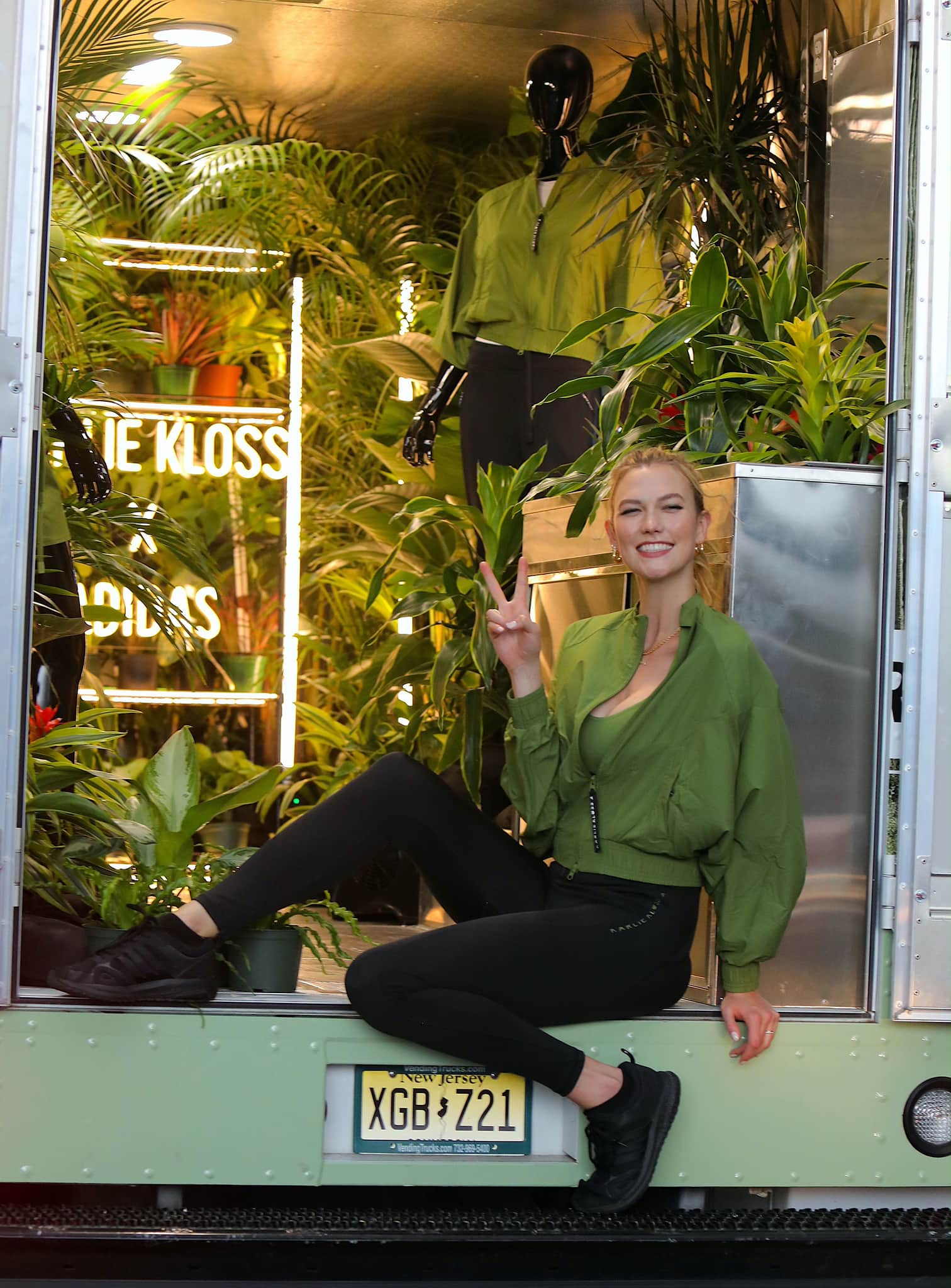 Karlie Kloss models pieces from her nature-themed Adidas line