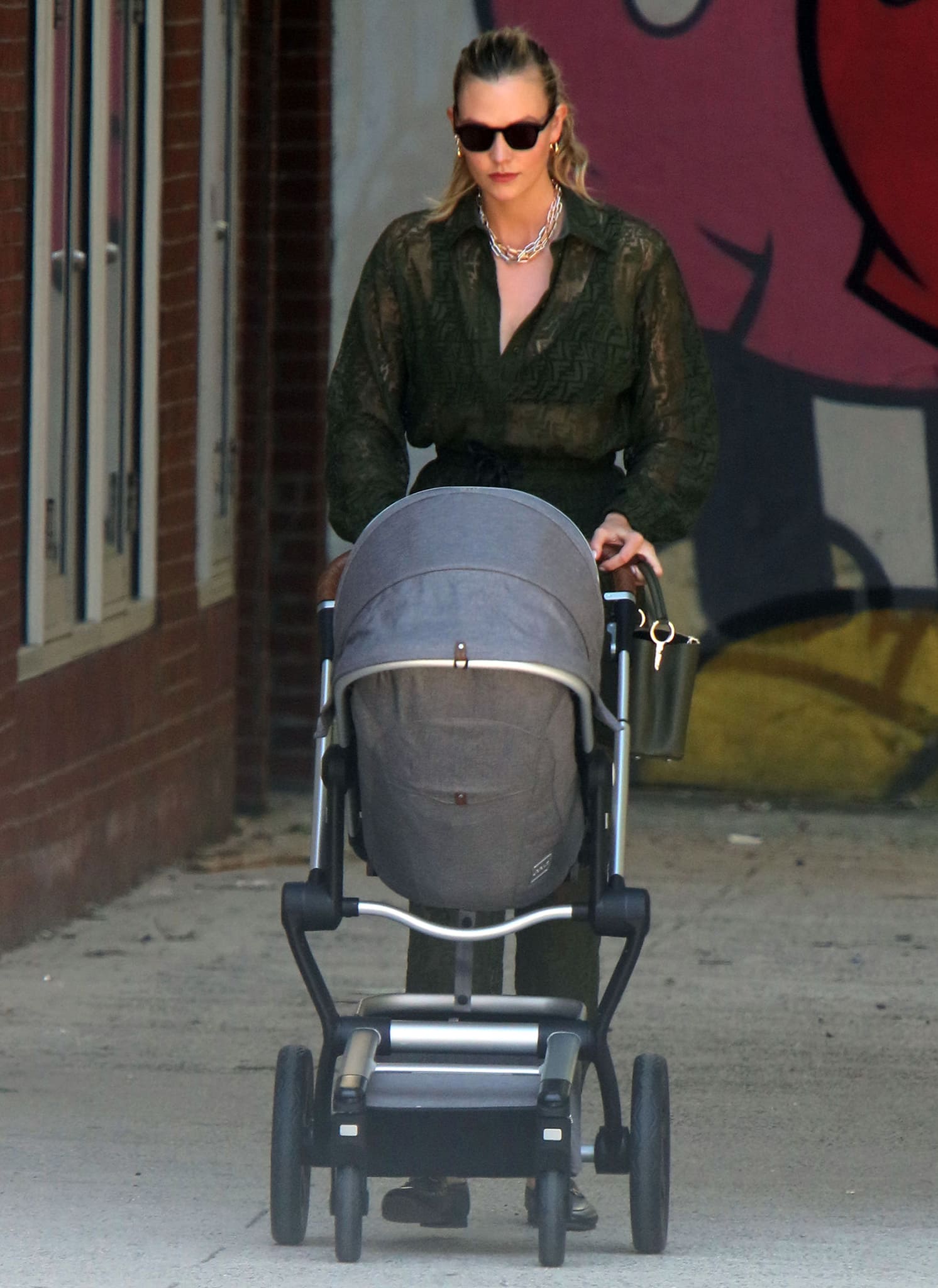 Karlie Kloss strolls with newborn son Levi in New York City on June 10, 2021