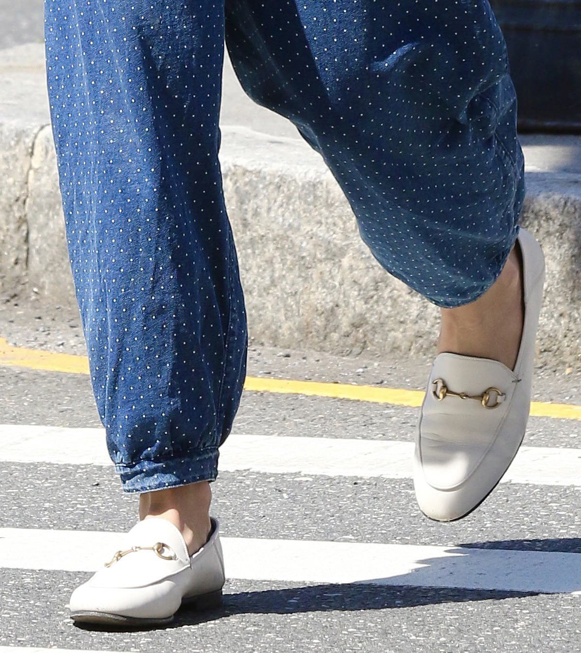 Katie Holmes completes her summer boho look with white Gucci Brixton collapsible-heel leather loafers