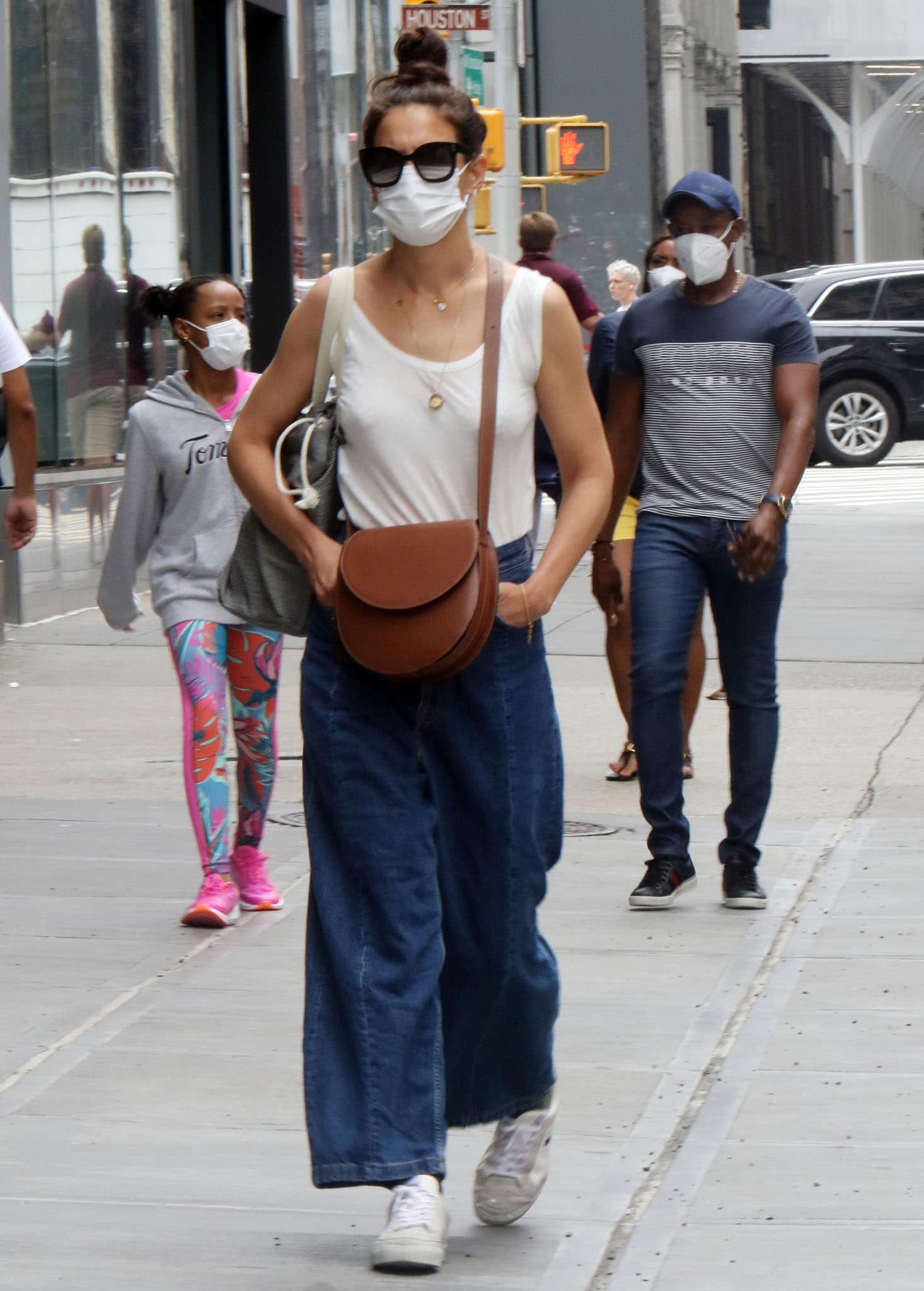 Katie Holmes embraces summertime chic in baggy denim jeans as she runs errands in New York City