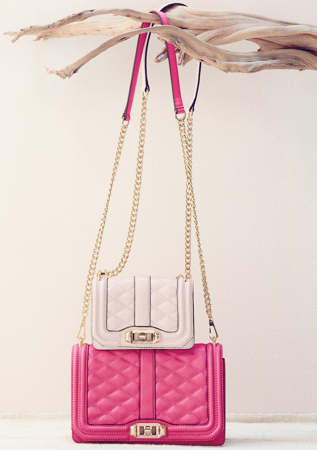 The petite version of the Love crossbody features turn-lock hardware and a chain strap