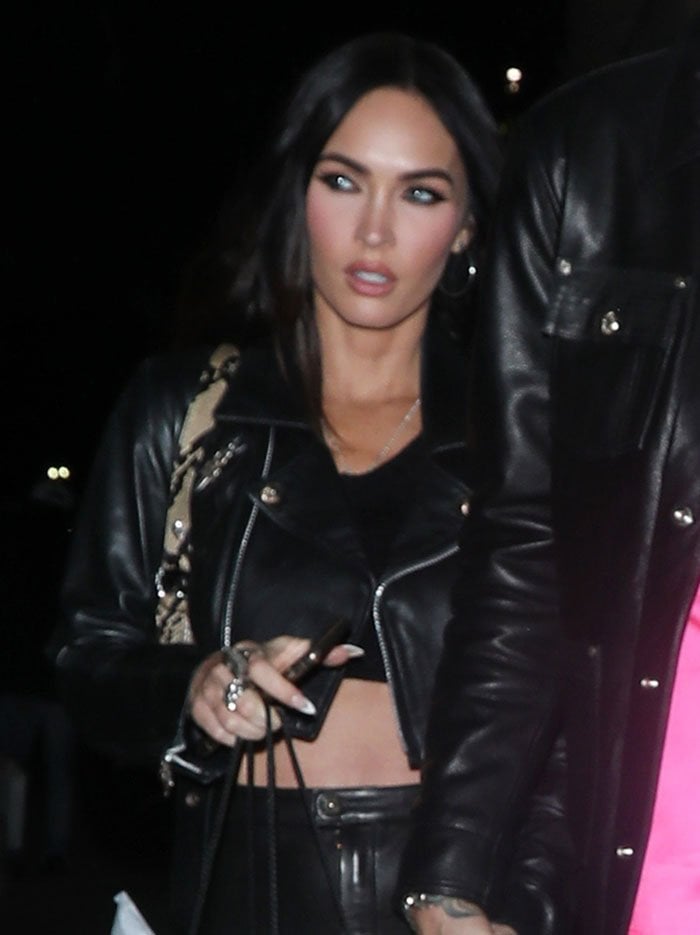 Megan Fox highlights her eyes with black mascara and eyeliner and wears her raven tresses loose around her shoulders