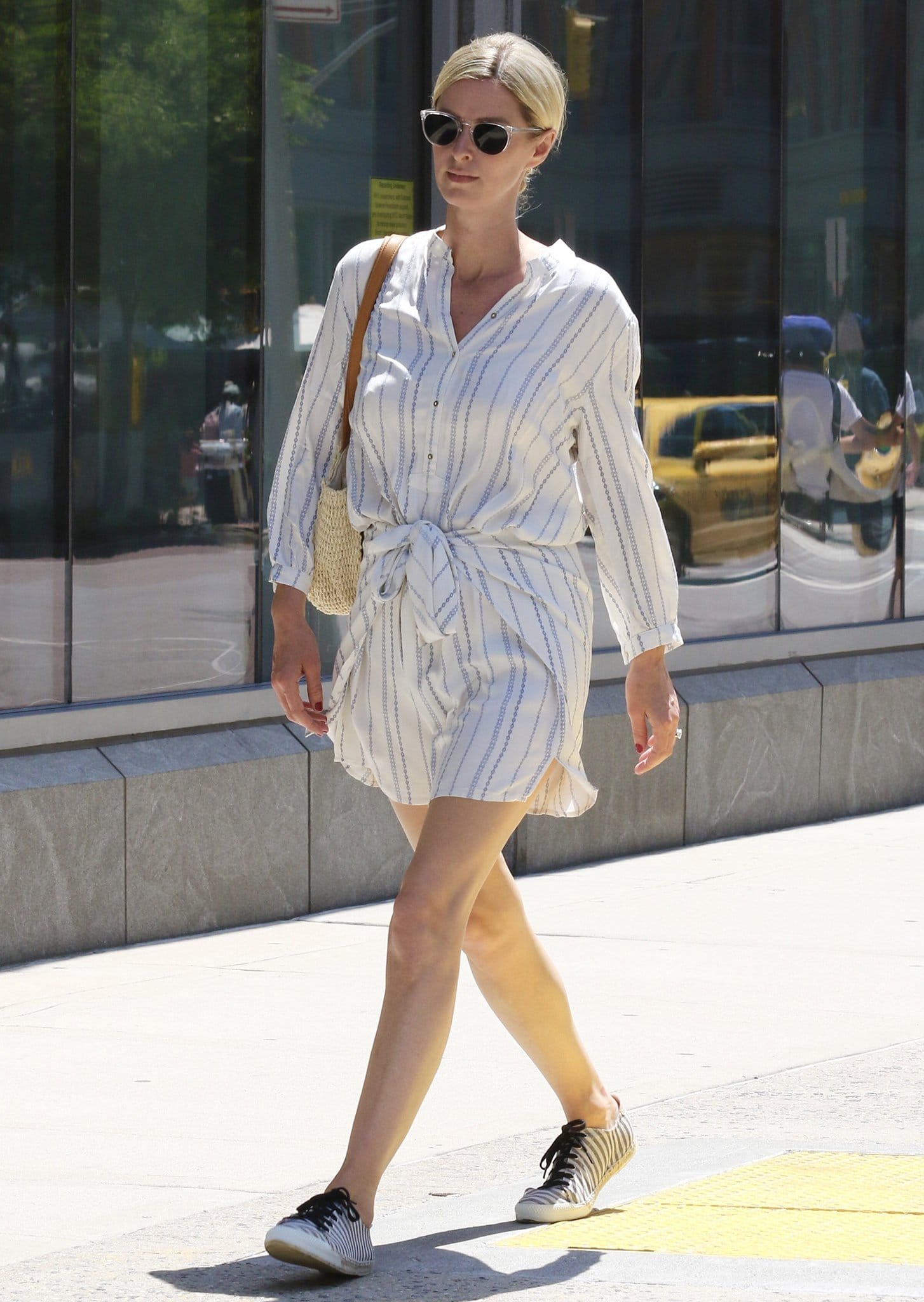 Nicky Hilton runs errands in a summery white striped romper in New York City on June 10, 2021