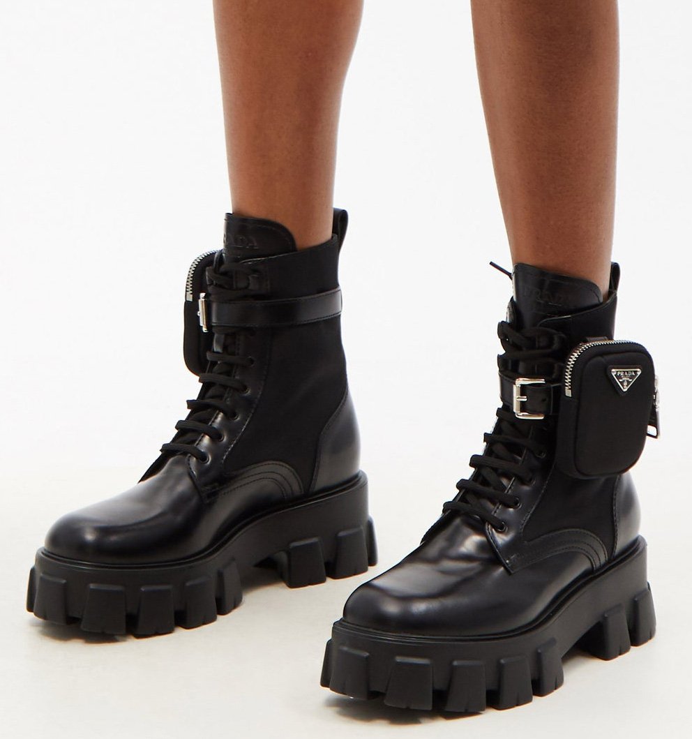 A pair of military-inspired boots with a detachable pouch and chunky lug soles