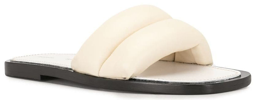 The Puffy slides feature a wide puffy quilted strap across the toes