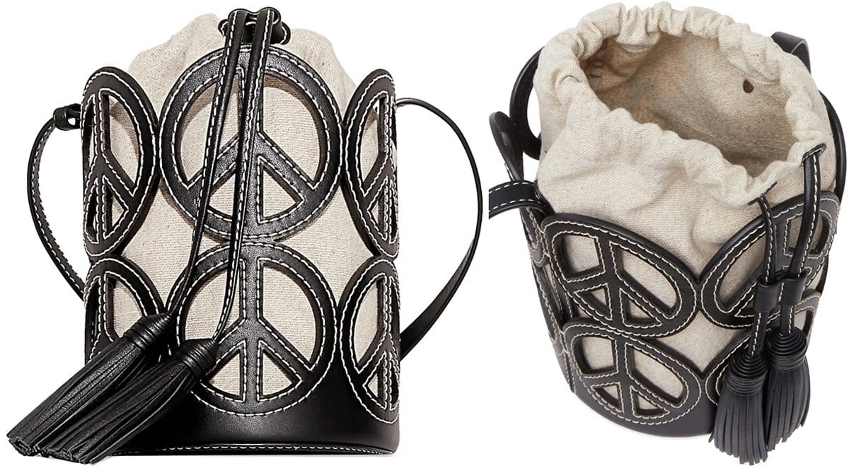 This petite-sized cross-stitch bucket bag is crafted from shiny goat leather in black with peace signs all over