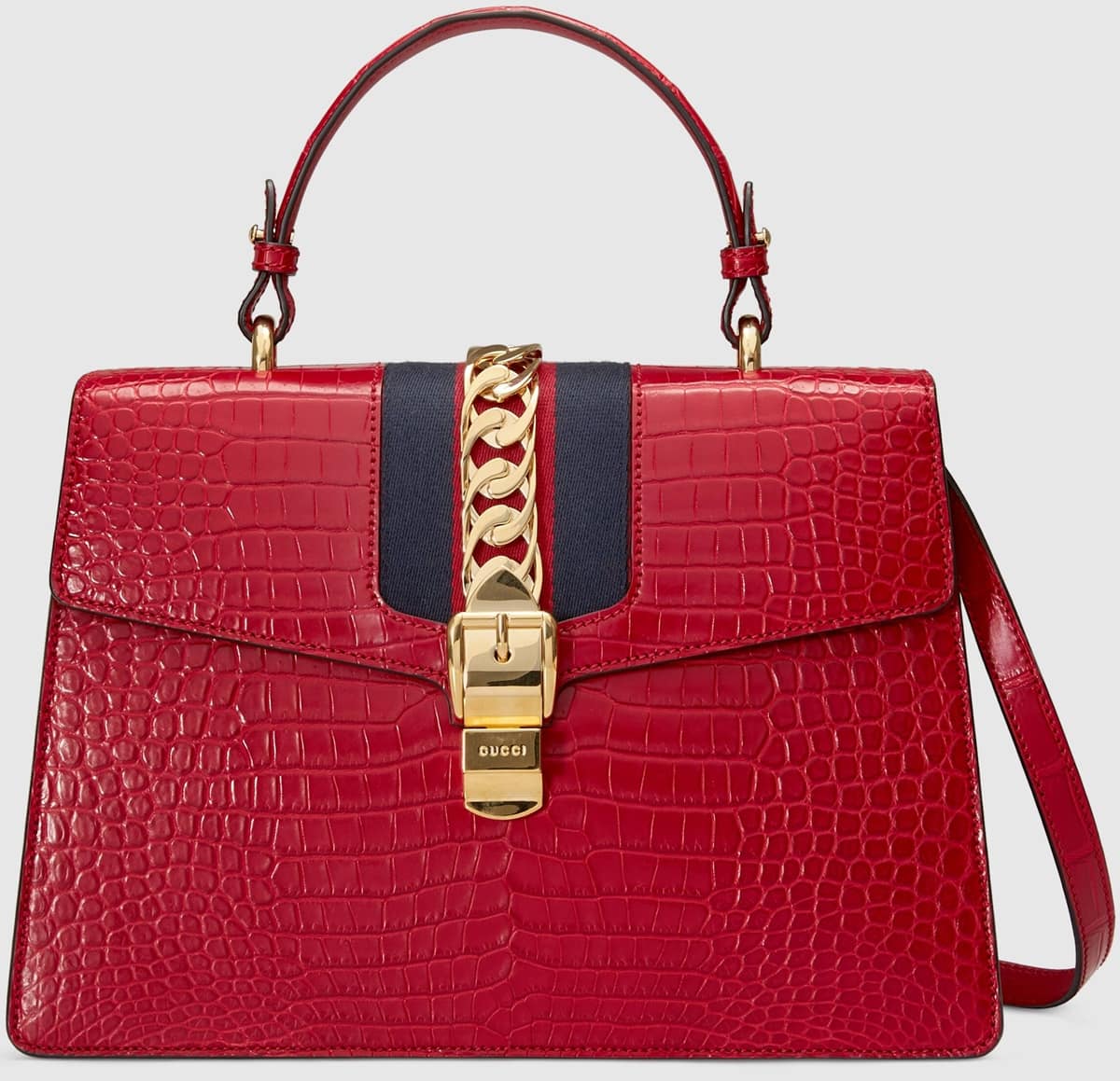 Gucci's Hibiscus red crocodile Sylvie top handle bag decorated with a gold chain and buckle