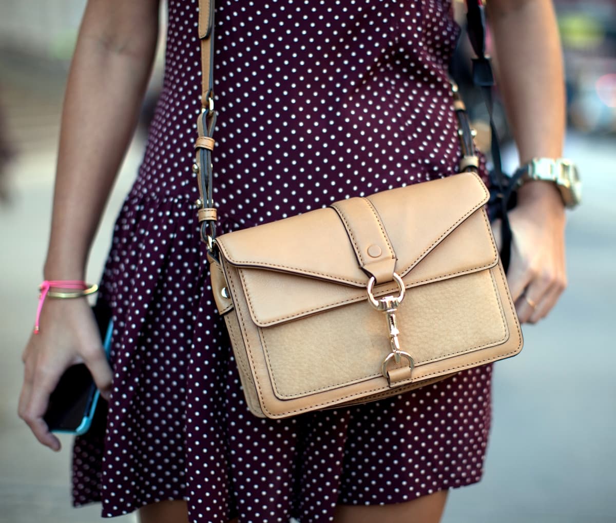 Sara Escudero shows off her authentic Rebecca Minkoff handbag during New York Women's Fashion Week