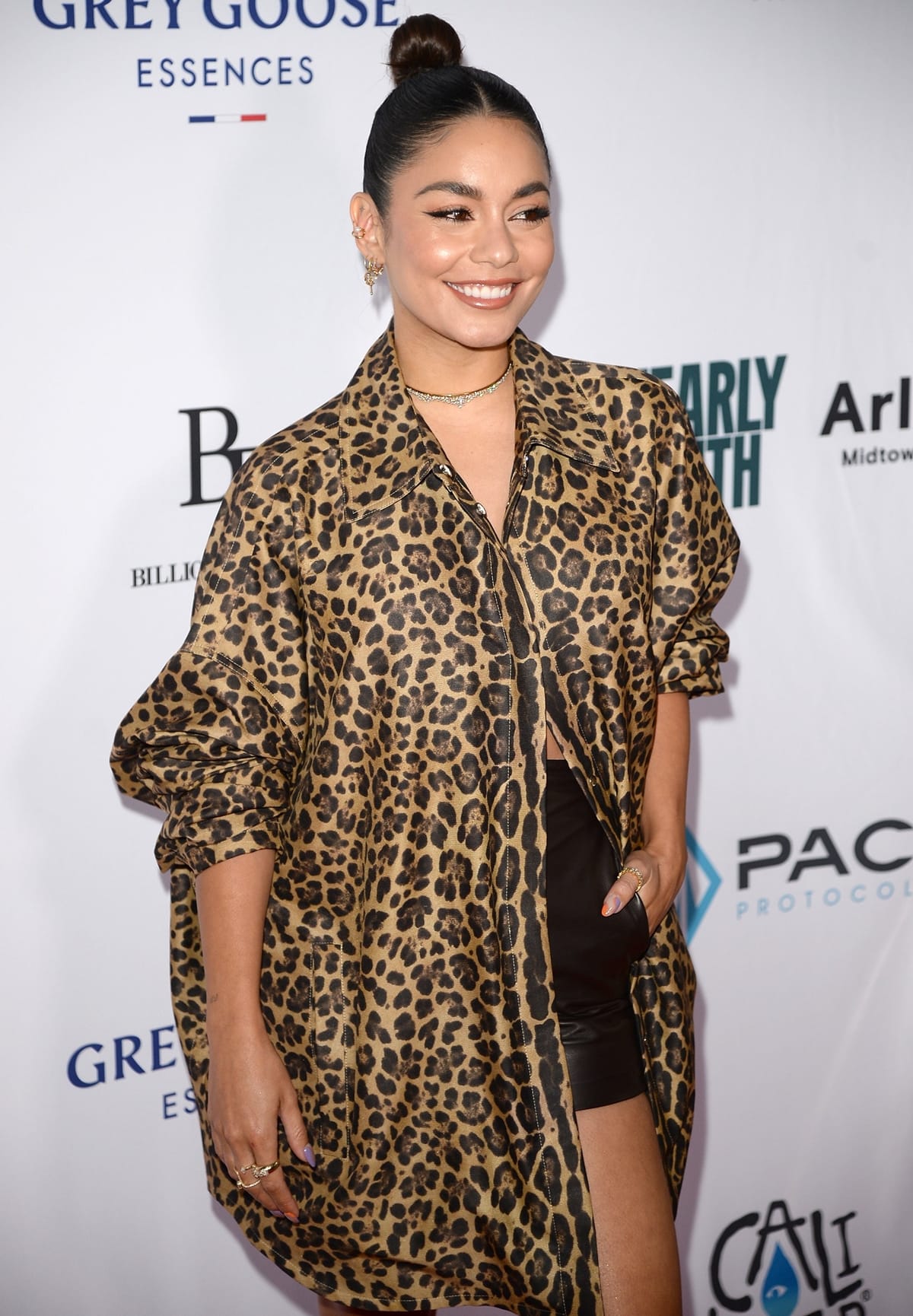 Vanessa Hudgens in an oversized Valentino leopard-print shirt that fuses classic glamour and streetwear aesthetics