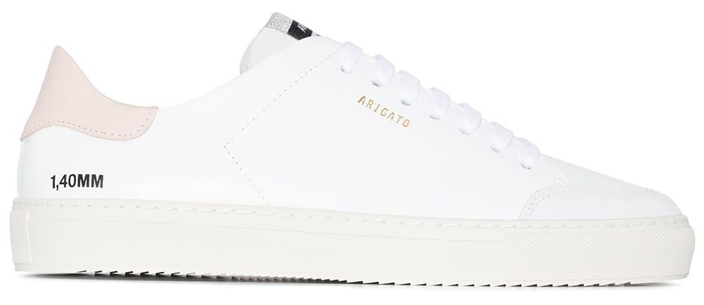 A minimalist pair of white leather sneakers updated with contrasting toe and heel counter