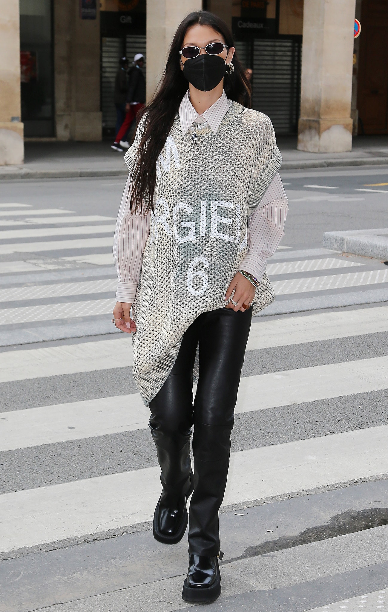 Bella Hadid on her way to the Loulou restaurant in MM6 Maison Margiela knit vest and leather trousers on June 26, 2021