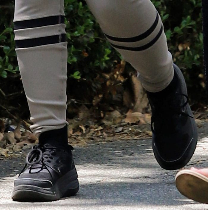 Camila Cabello completes her running outfit with black socks and chunky platform running shoes