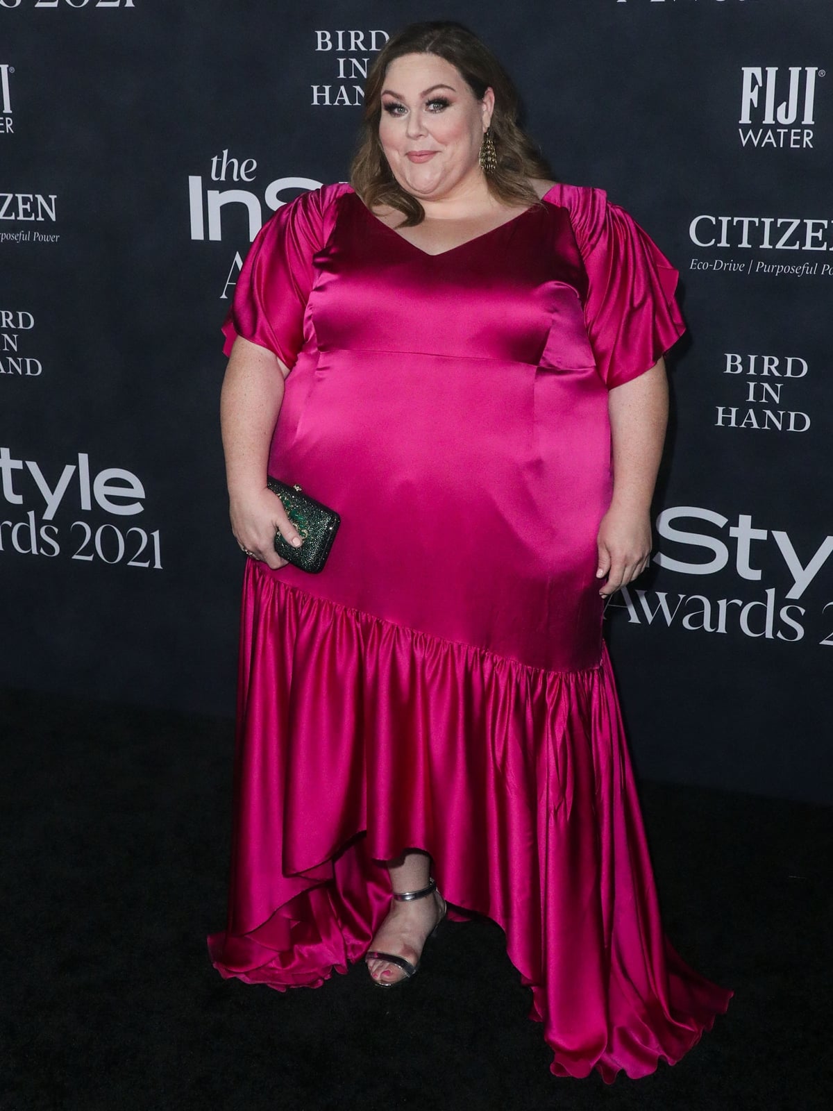 Chrissy Metz in a pink dress and metallic sandals at the 2021 InStyle Awards