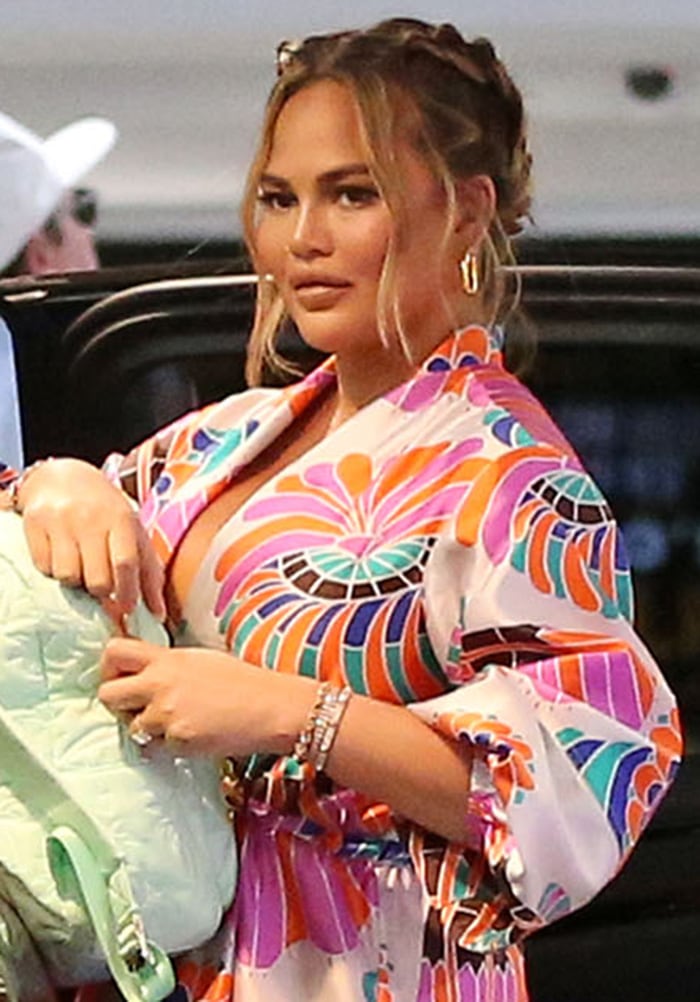 Chrissy Teigen looks fresh and chic with her braided updo and neutral makeup
