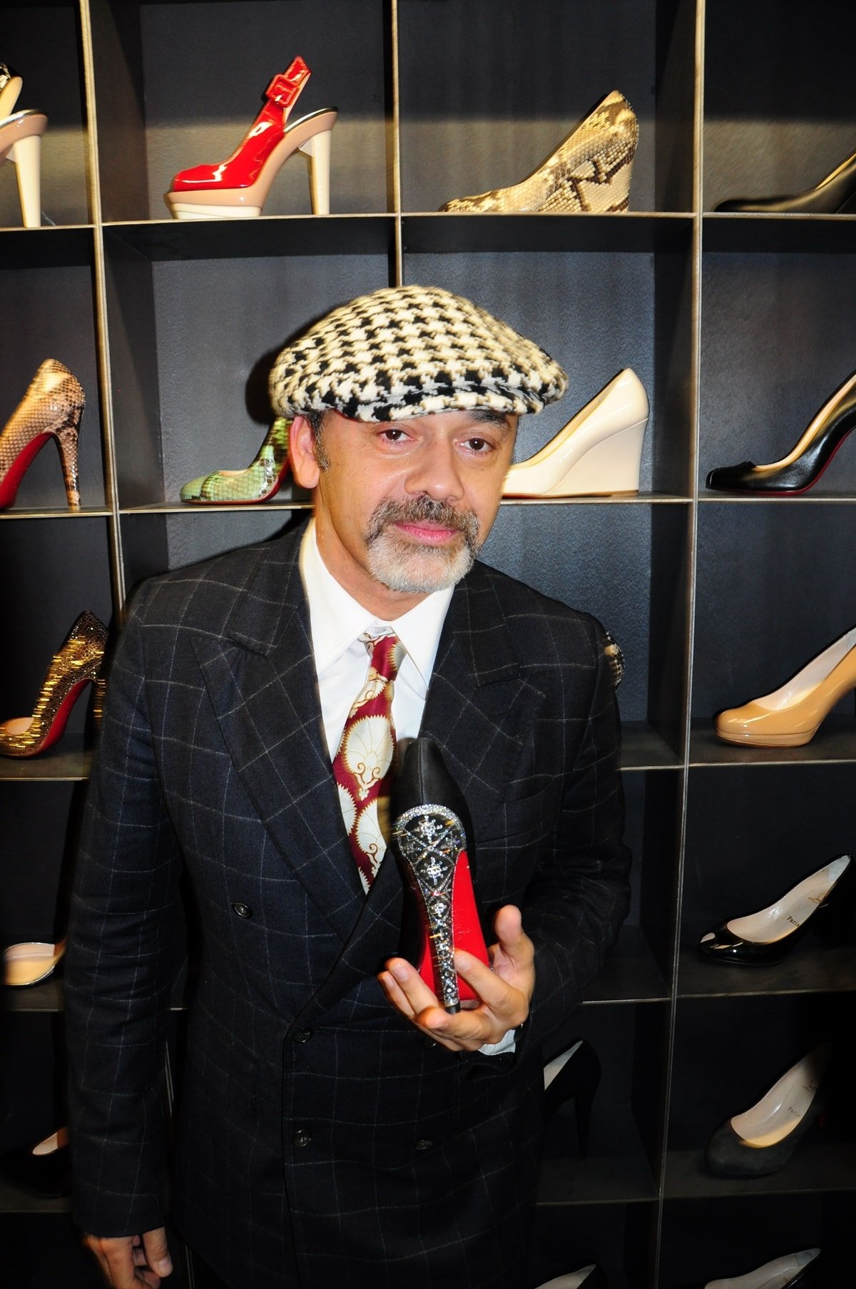 Christian Louboutin promoting his red sole shoes in Berlin