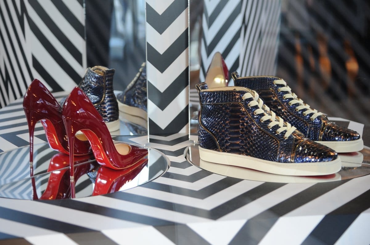 Christian Louboutin high heel pumps and sneakers displayed in his boutique located at Selfridges Exchange Square Store Manchester