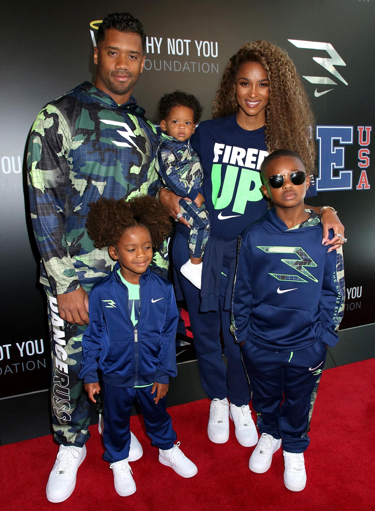 Russell Wilson launches 3BRAND clothing line with Ciara and their three kids, sons Future Jr, 7, and Win, 11 months, and daughter Sienna, 4, at Rookie USA Flagship Store in NYC