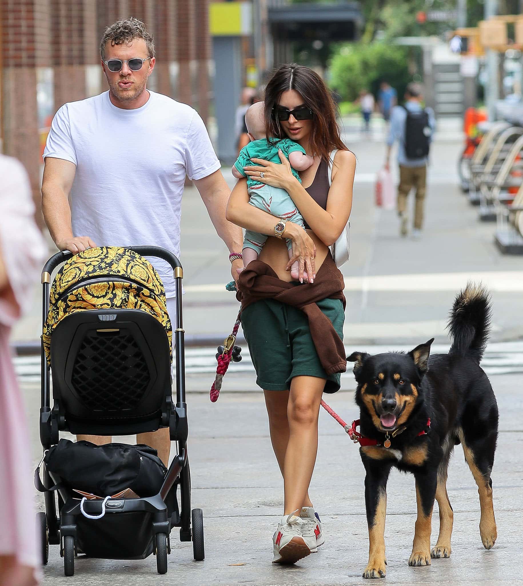 Sebastian Bear-McClard and Emily Ratajkowski take their son Sylvester and dog Colombo out in New York City on July 10, 2021