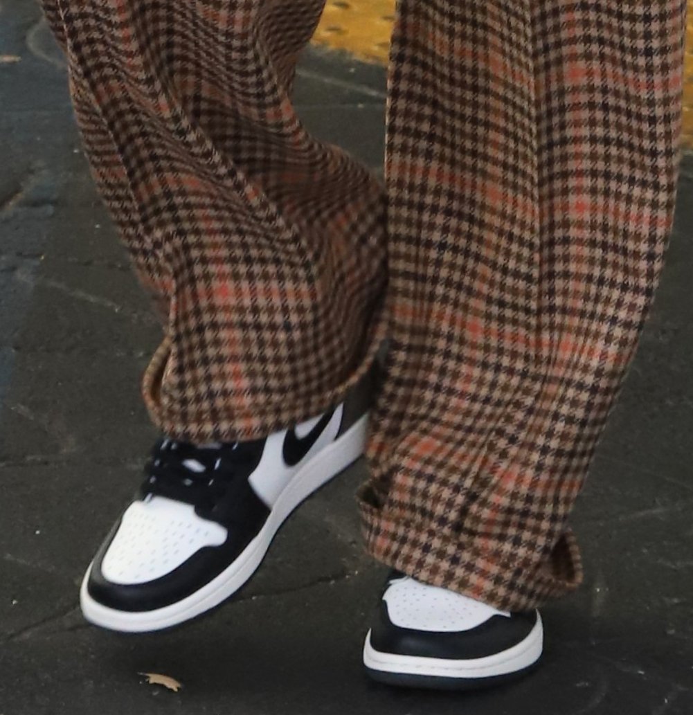 Hailey Bieber gives her chic outfit a touch of sporty vibe with Nike Air Jordan 1 High in Dark Mocha