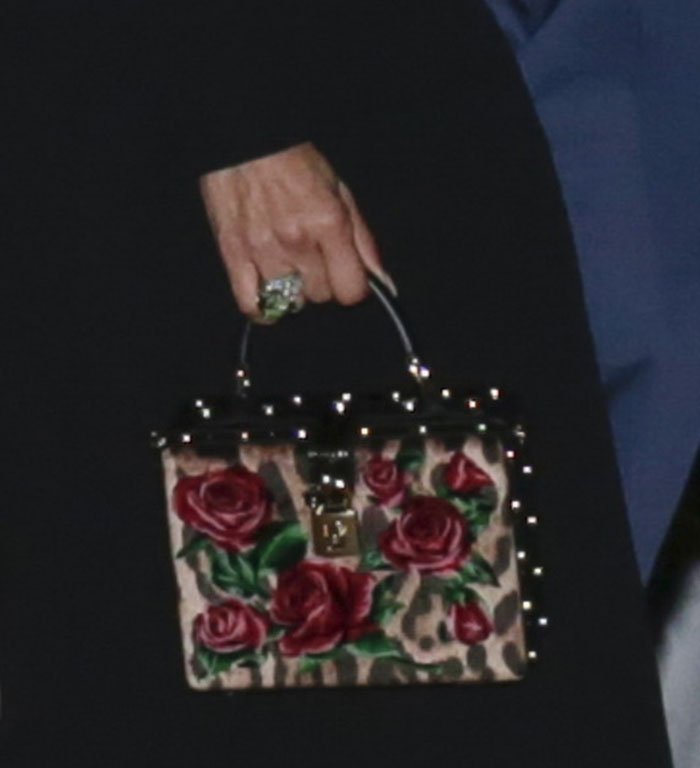 Jennifer Lopez carries her night essentials in a Dolce & Gabbana leopard and floral velvet box bag