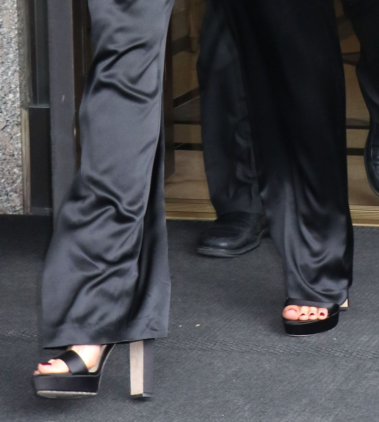 Kate Beckinsale completes a monochrome black look with black Jimmy Choo Holly sandals