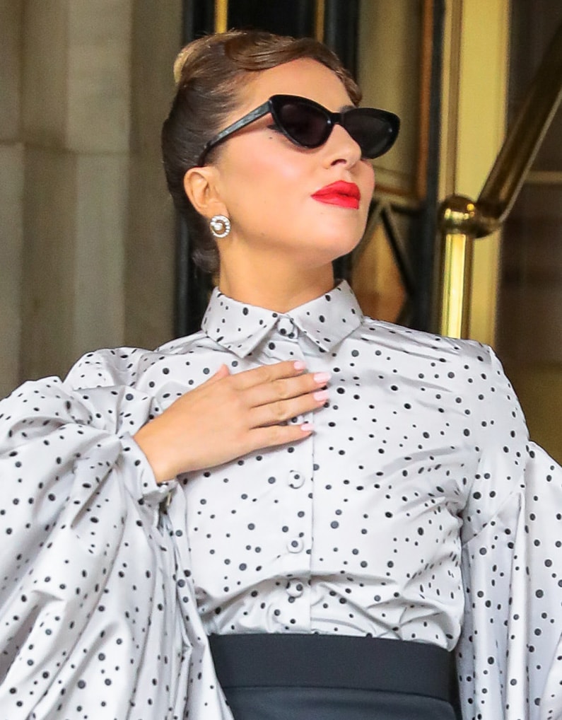 Lady Gaga opts for old Hollywood glamour with a French twist hairstyle and a swipe of red lipstick