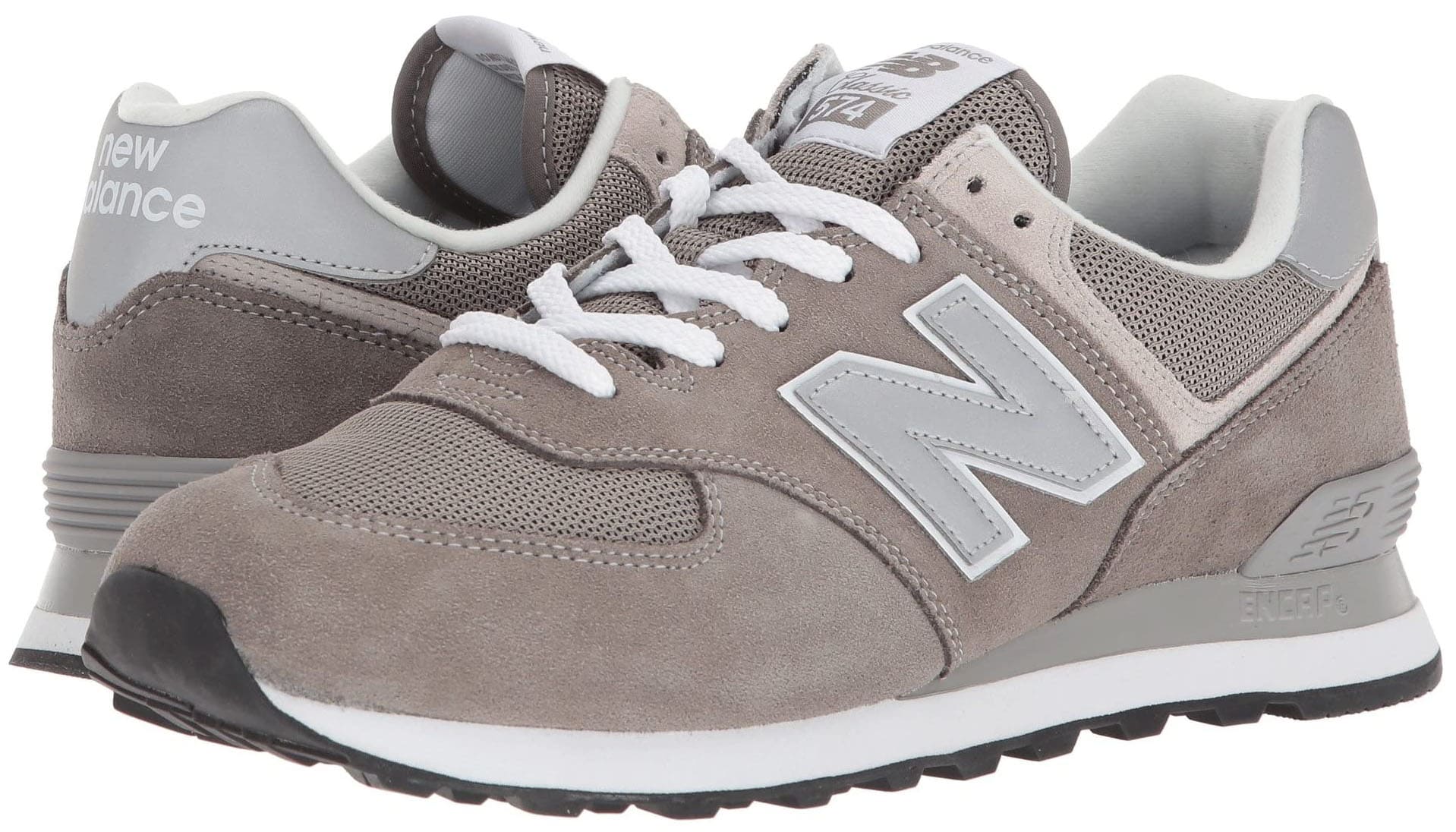 A vintage casual-runner shoe featuring New Balance's iconic 574 silhouette in suede and mesh upper