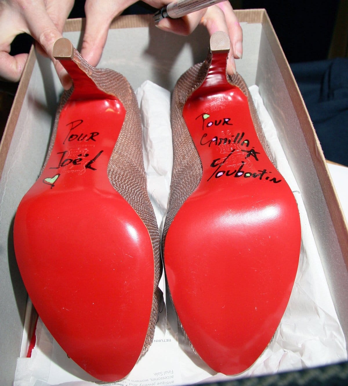 Red sole Christian Louboutin shoes signed by the designer himself