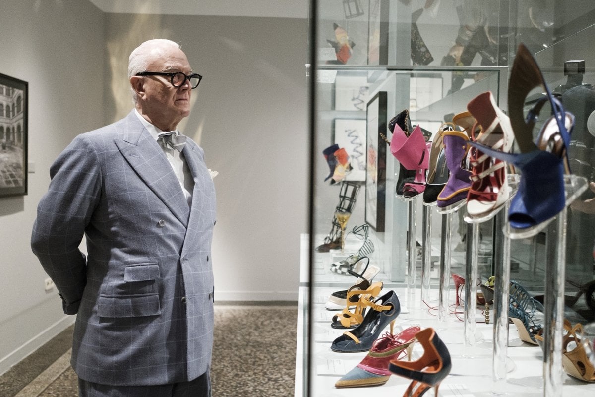 Spanish designer Manolo Blahnik poses during 'The Art of Shoe' exhibition at the National Museum of Decorative Arts in Madrid