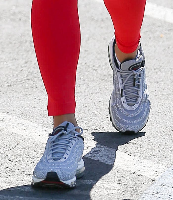 Vanessa Hudgens slips into a pair of Swarovski x Nike Air Max 97 shoes