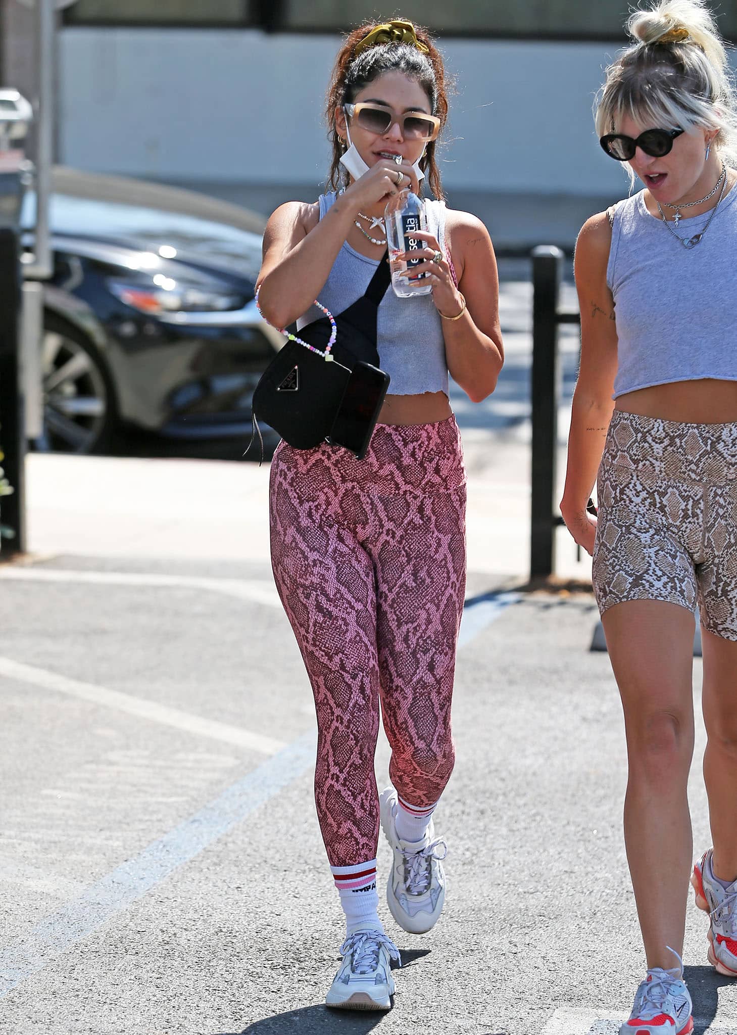 Vanessa Hudgens showed off her abs in a gray tank top with Skatie pink snake-print leggings