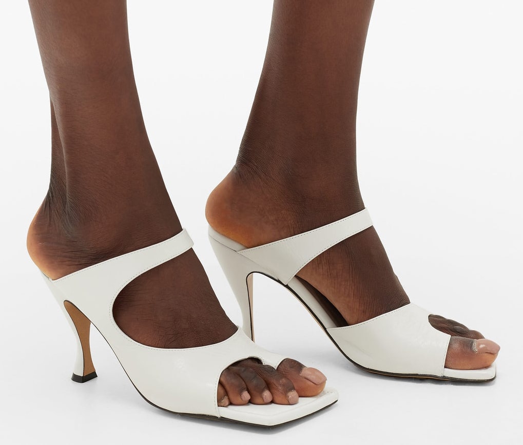 Bottega Veneta's white cutout leather mules feature square toes, cutout vamps, and 3.5-inch heels