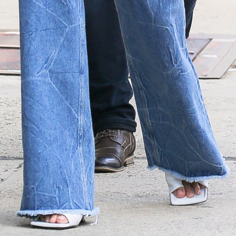 Chrissy Teigen completes her look with Bottega Veneta white mules