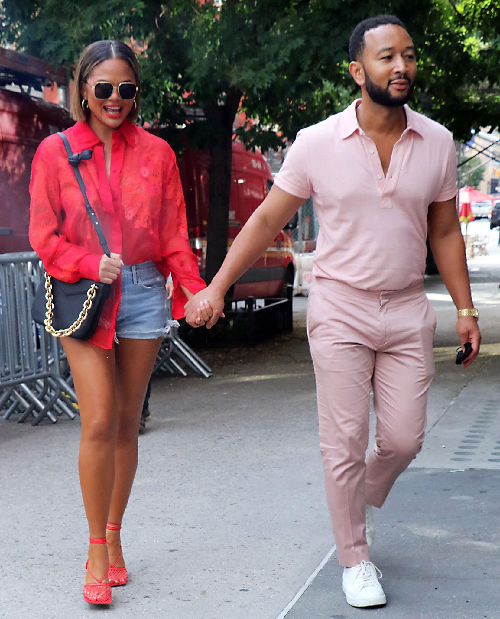 Chrissy Teigen and John Legend stroll around Soho in New York City on August 20, 2021