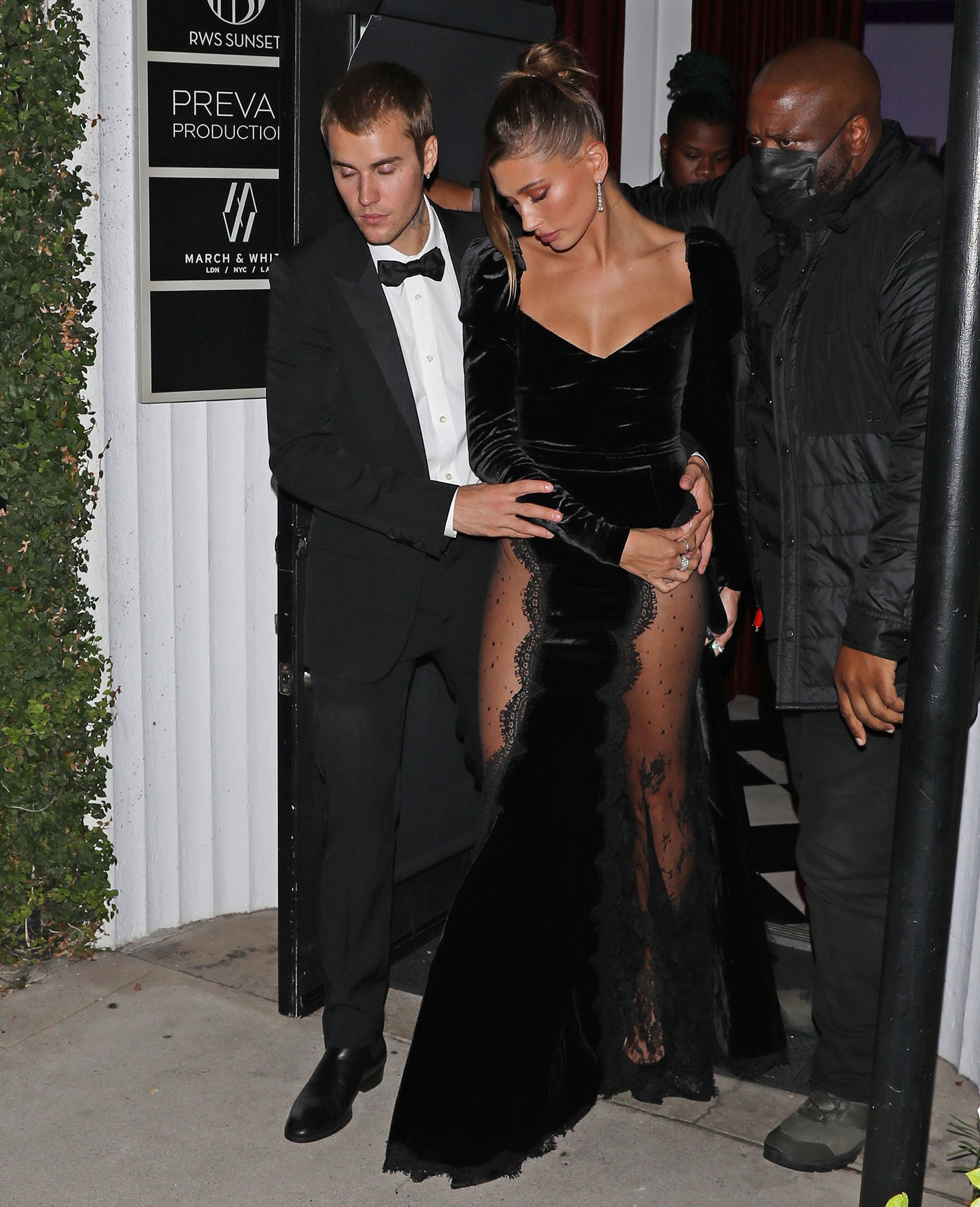 Hailey Bieber steals her husband's thunder in Alessandra Rich black velvet gown with lace-covered thigh-high slits