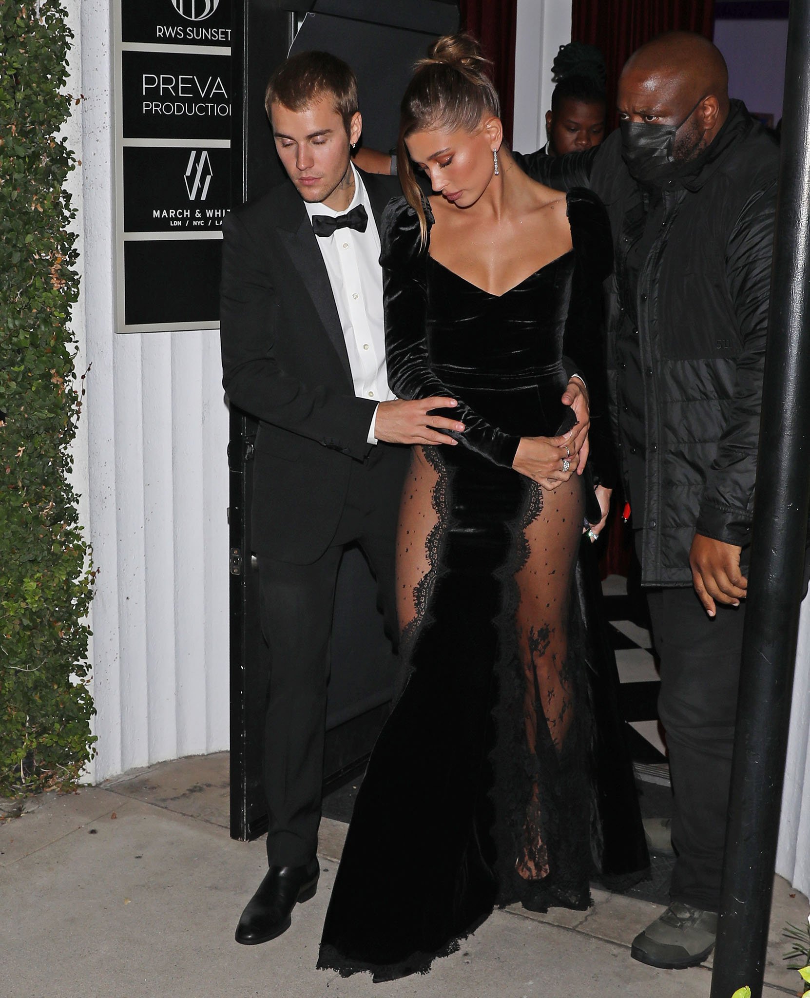 Hailey Bieber steals her husband's thunder in an Alessandra Rich black velvet gown with lace-covered thigh-high slits