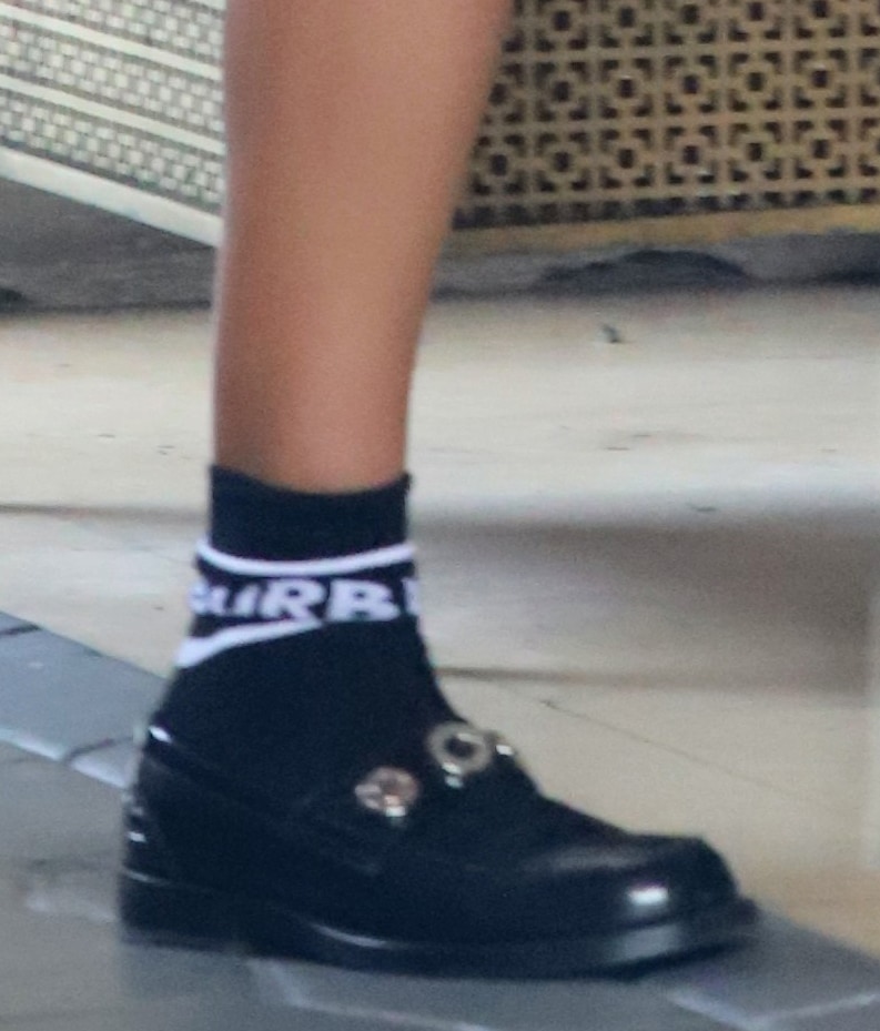 Irina Shayk pairs her casual outfit with crew socks and dressy loafers