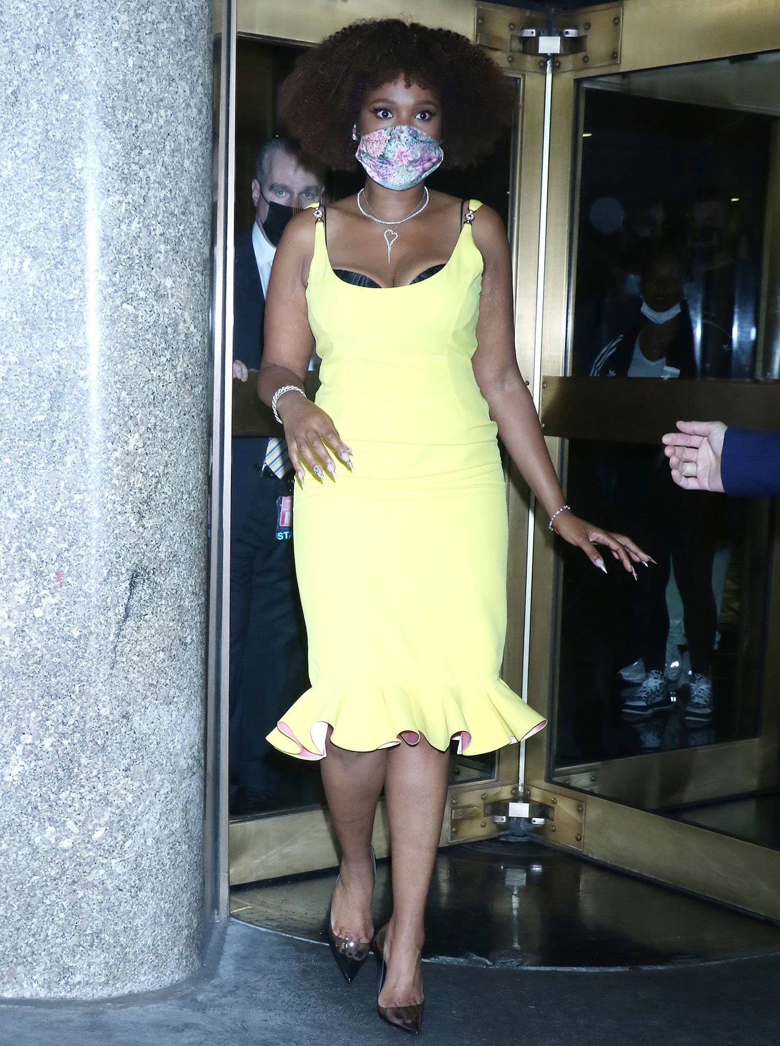 Jennifer Hudson shows off her figure in a yellow Versace Spring 2021 midi dress