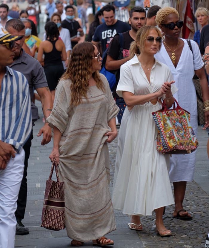 Jennifer Lopez pairs her flowy cutout dress with gold Havaianas flip-flops