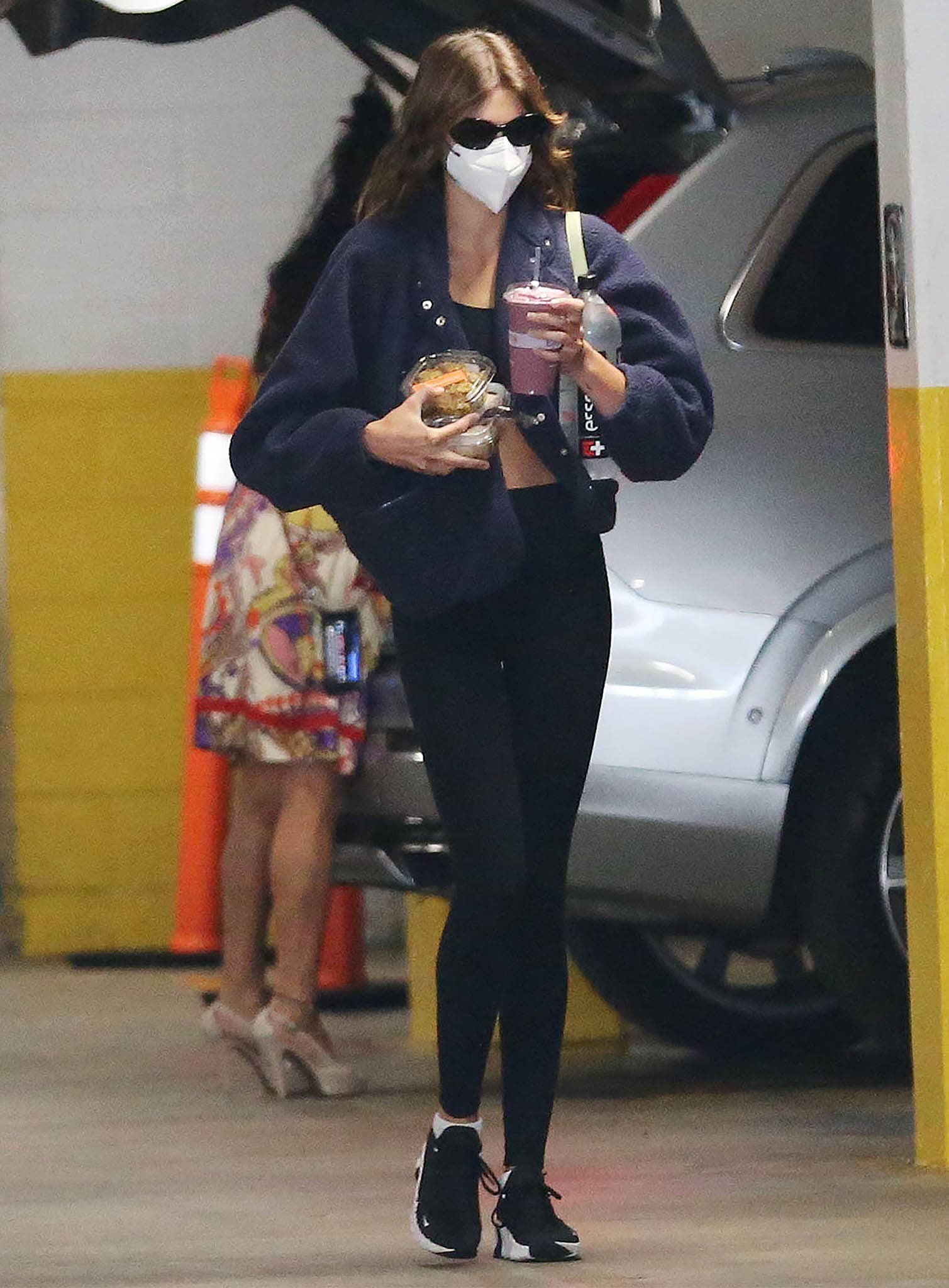 Kaia Gerber Wears Alo Lounge Leggings And Nike Free Metcon 4 Shoes