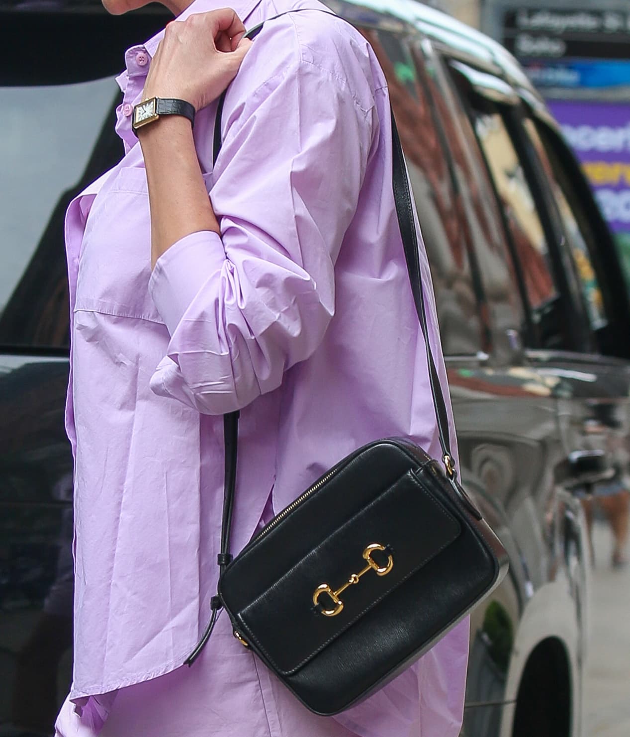 Karlie Kloss carries a Gucci Horsebit 1955 black leather bag from the vintage-inspired 1955 collection