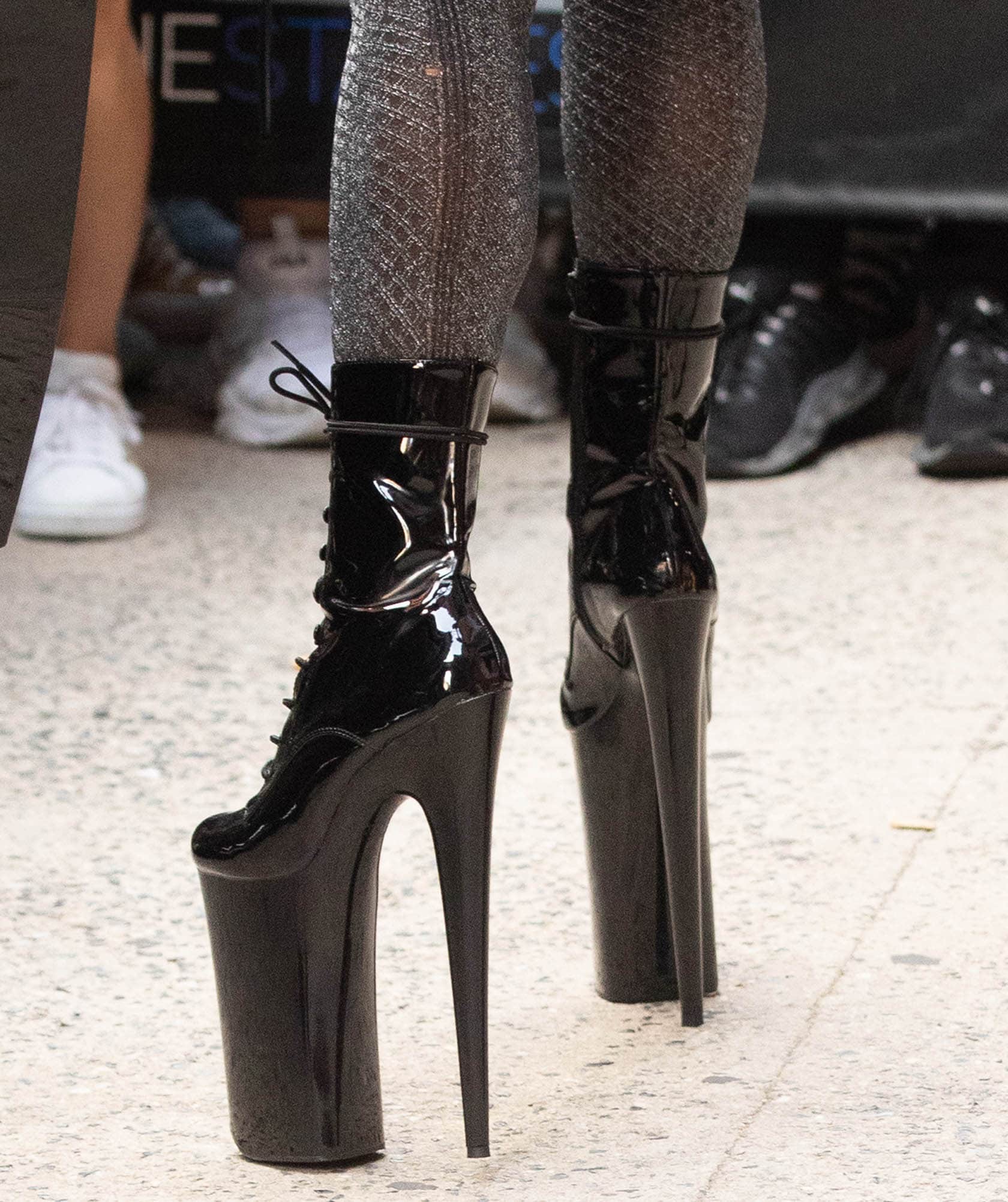 Lady Gaga completes a daring monochrome look with Pleaser Infinity sky-high platform boots