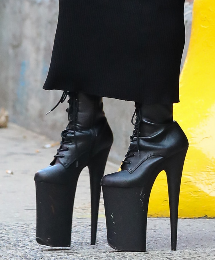 Lady Gaga teeters on a pair of Pleaser Infinity boots with monstrous 9-inch heels