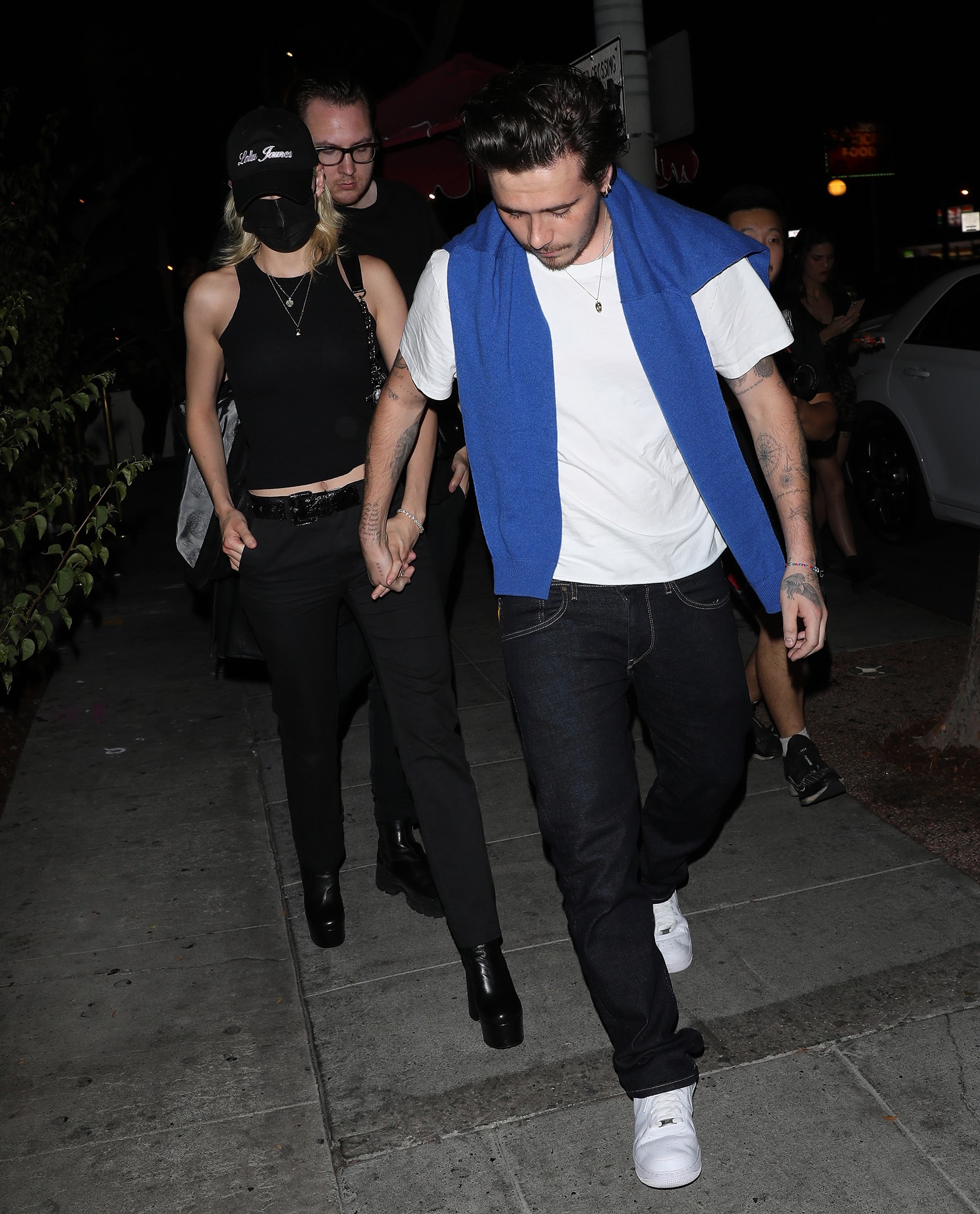 Nicola Peltz and Brooklyn Beckham hold hands while leaving the Delilah restaurant in West Hollywood on August 18, 2021