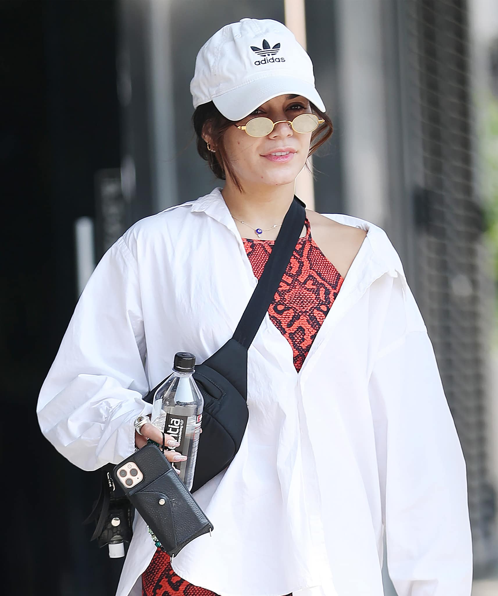 Vanessa Hudgens keeps a low-key look with an Adidas cap and Roberi & Fraud sunglasses