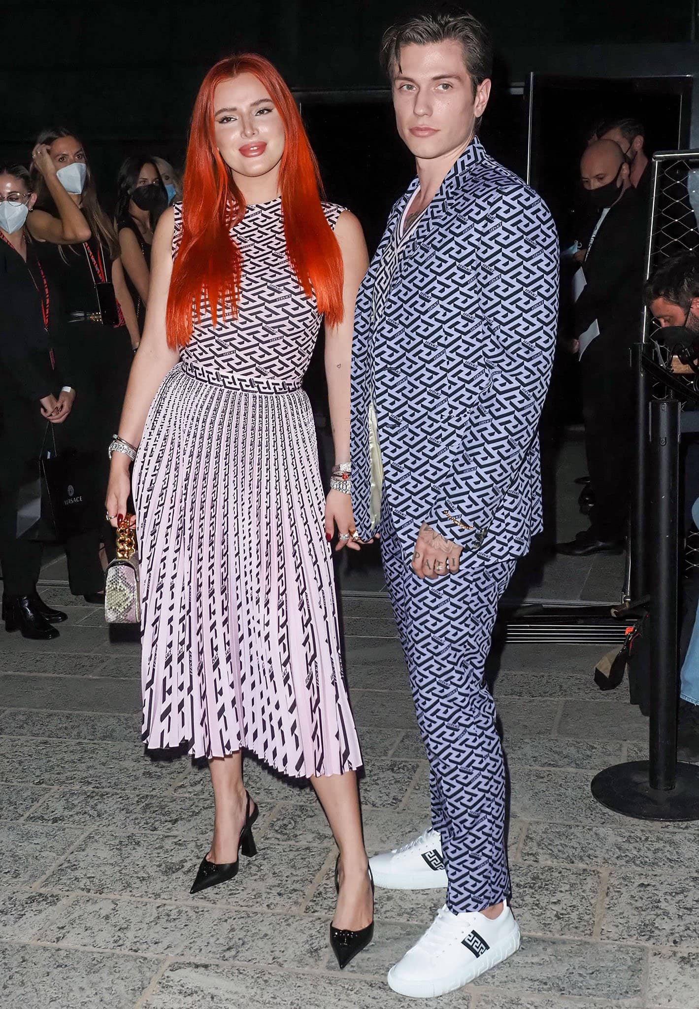 Benjamin Mascolo coordinates his outfit with Bella Thorne in a Versace La Greca suit