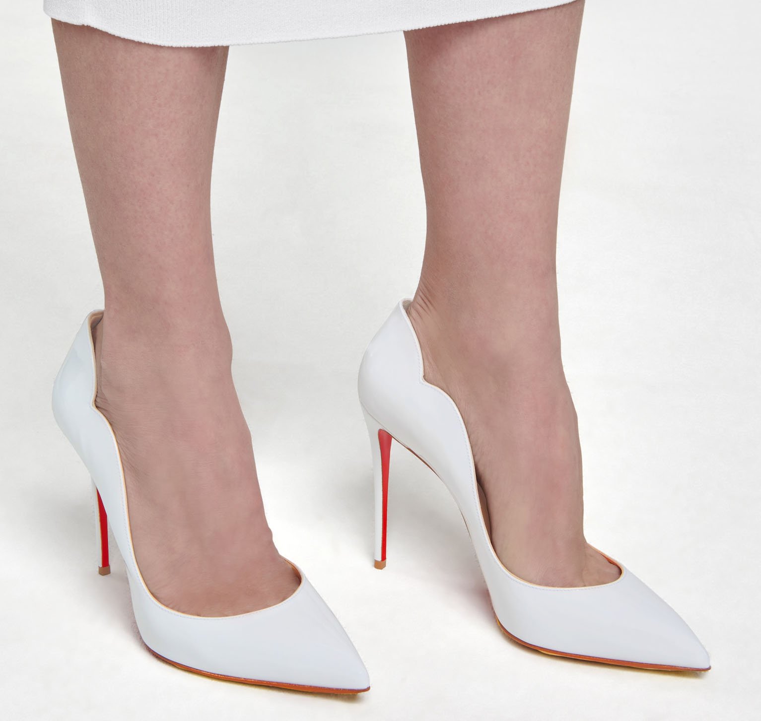 Christian Louboutin's Hot Chick is a modern take on the classic pump silhouette with its notched scalloped collar