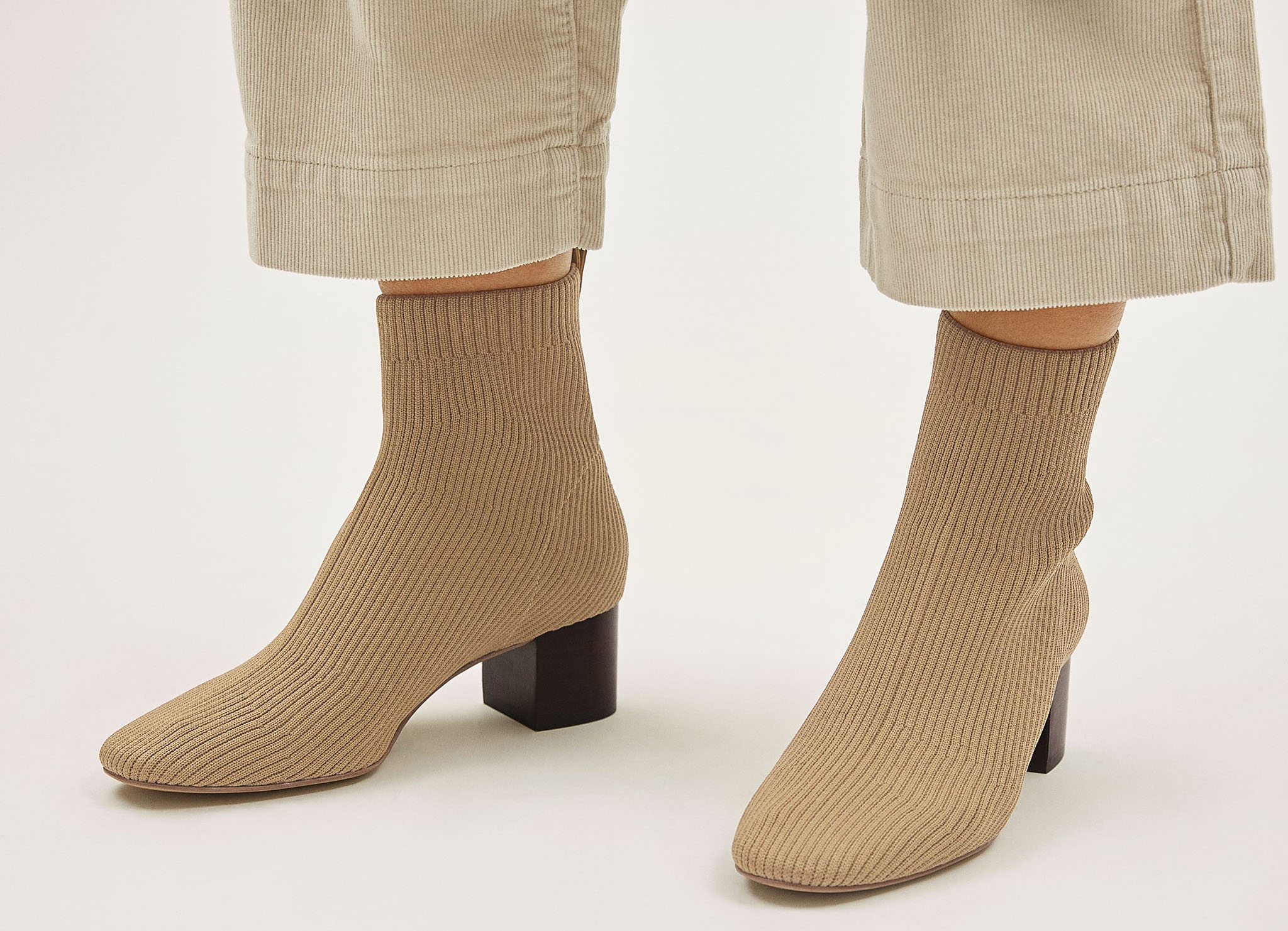 A flattering pair of boots made from textured re-knit fabric with chic rib detailing and comfy heels