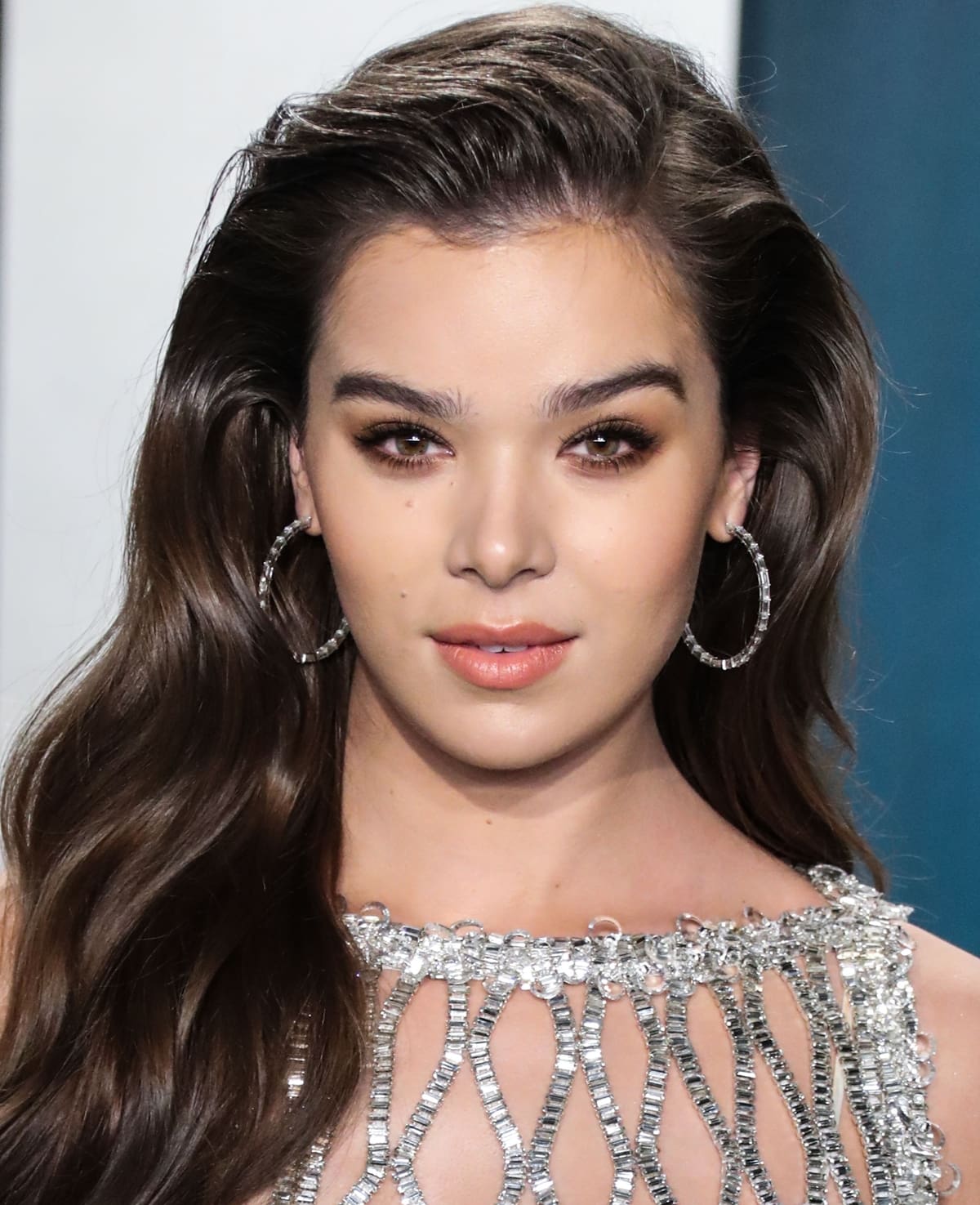 Hailee Steinfeld dazzles at the Vanity Fair Oscar Party, wearing Anita Ko's 18k gold large baguette diamond hoops—perfectly complementing her crystal-embellished gown for a radiant red carpet moment